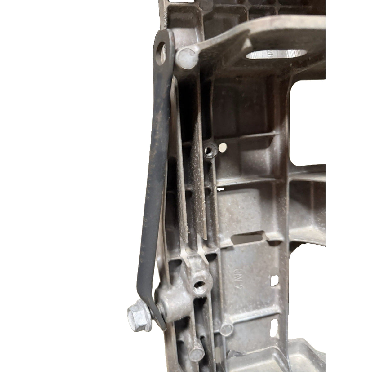 GM OEM suspension crossmember ribs and mounting-hole close-up