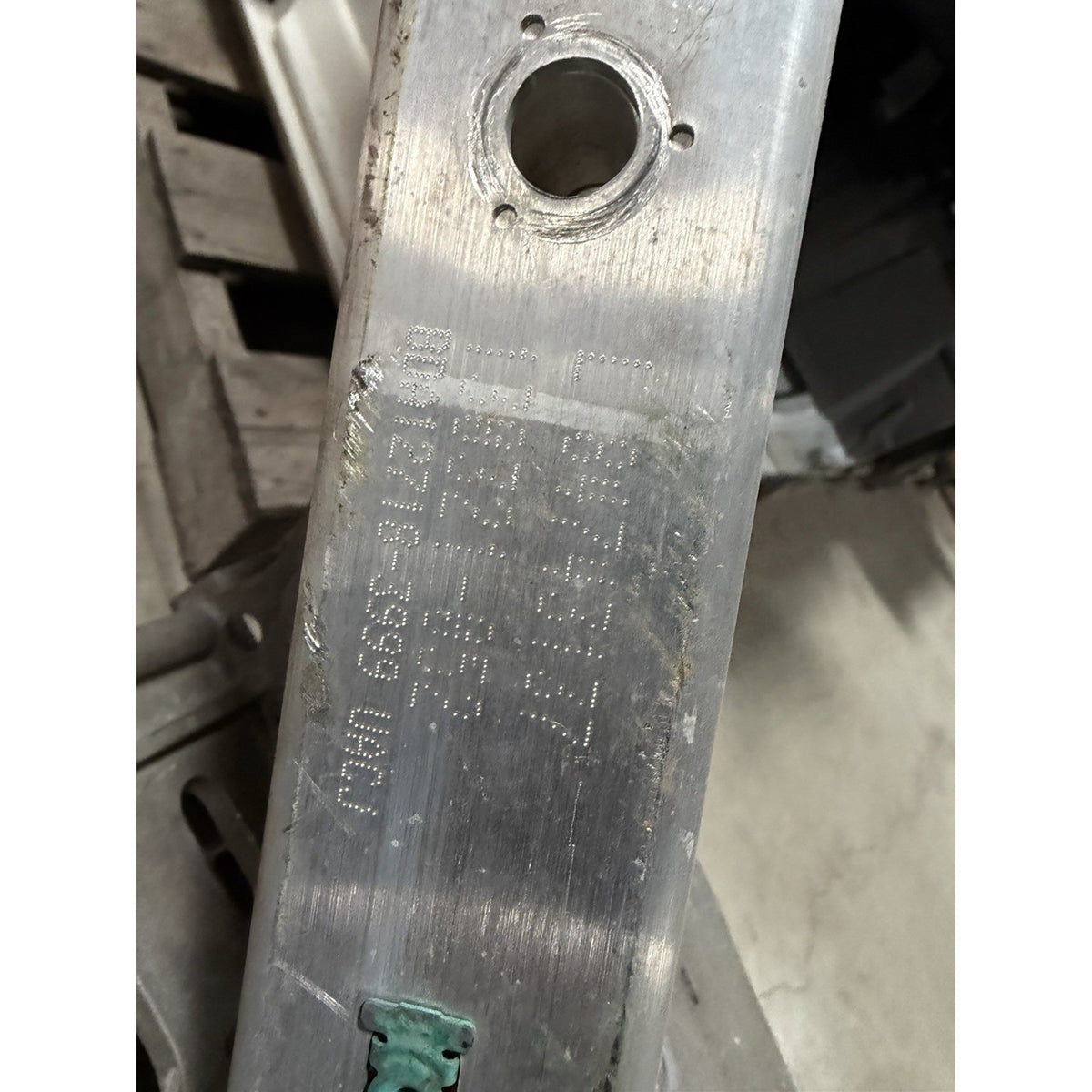Original stamped markings on the GM OEM suspension crossmember