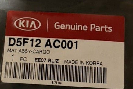 Kia Optima cargo mat D5F12-AC001 – original OEM part-number label