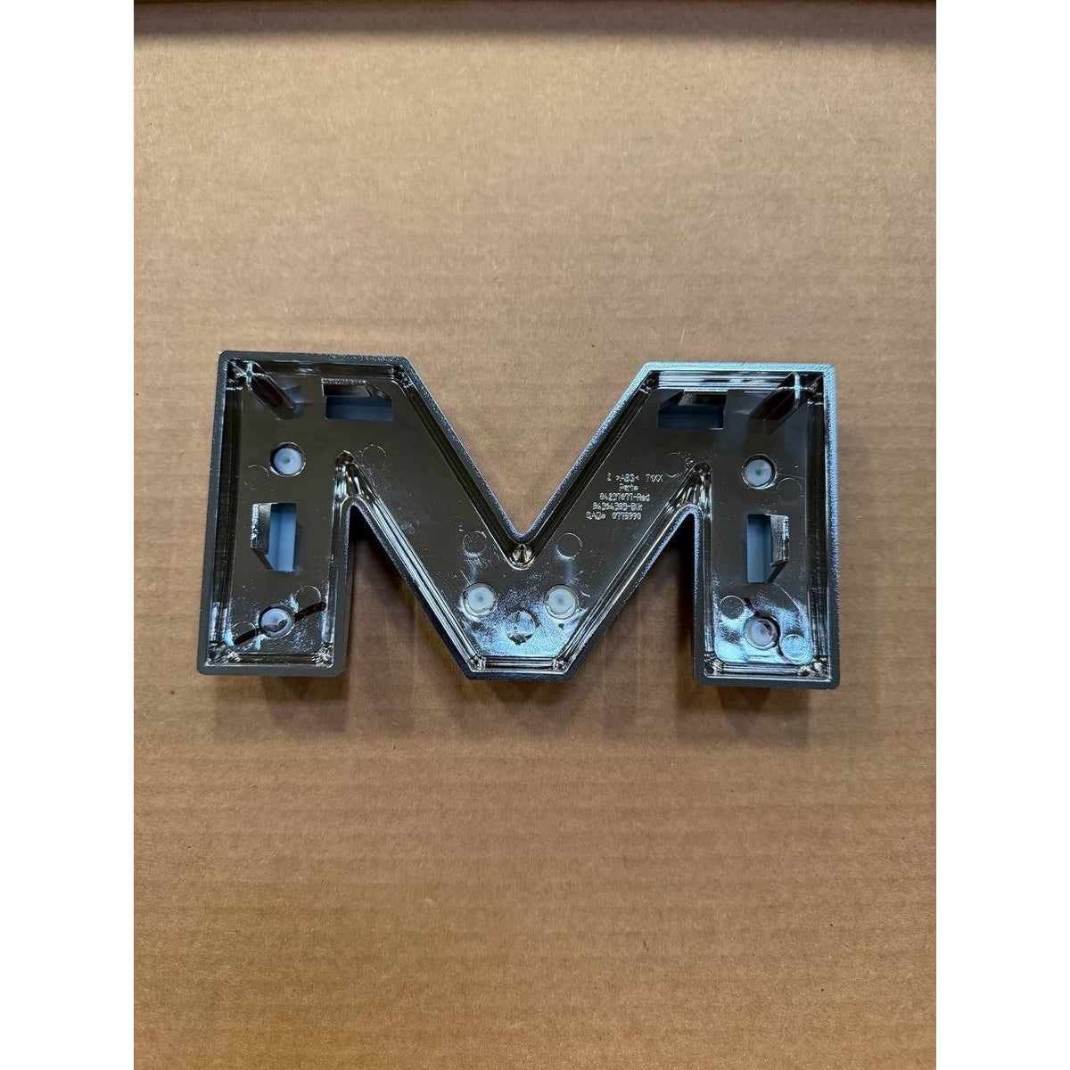 2019-2026 GMC Sierra 1500 Front Grille Emblem "M" OEM New GM 87815669