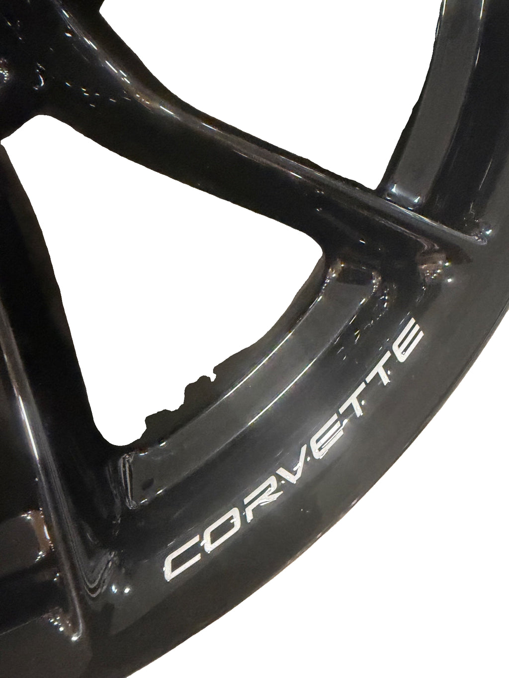 Corvette lettering close-up on the gloss-black forged wheel