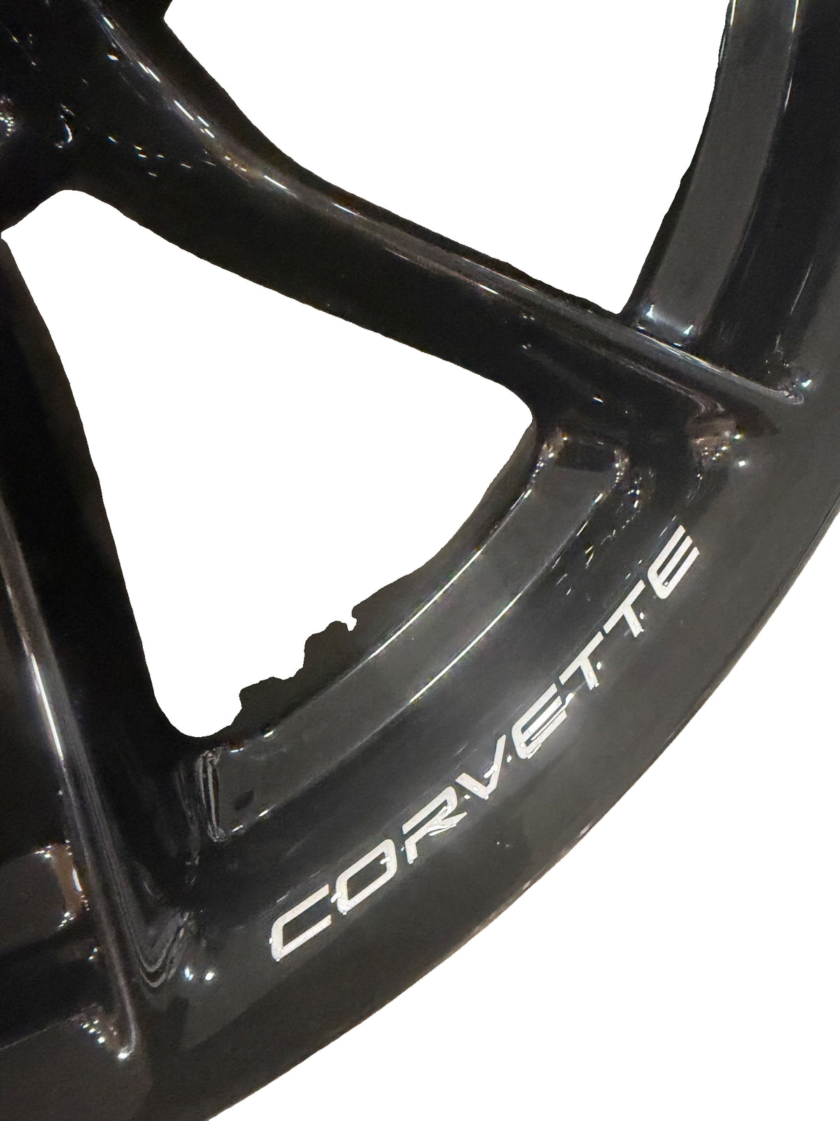 Corvette lettering close-up on the gloss-black forged wheel