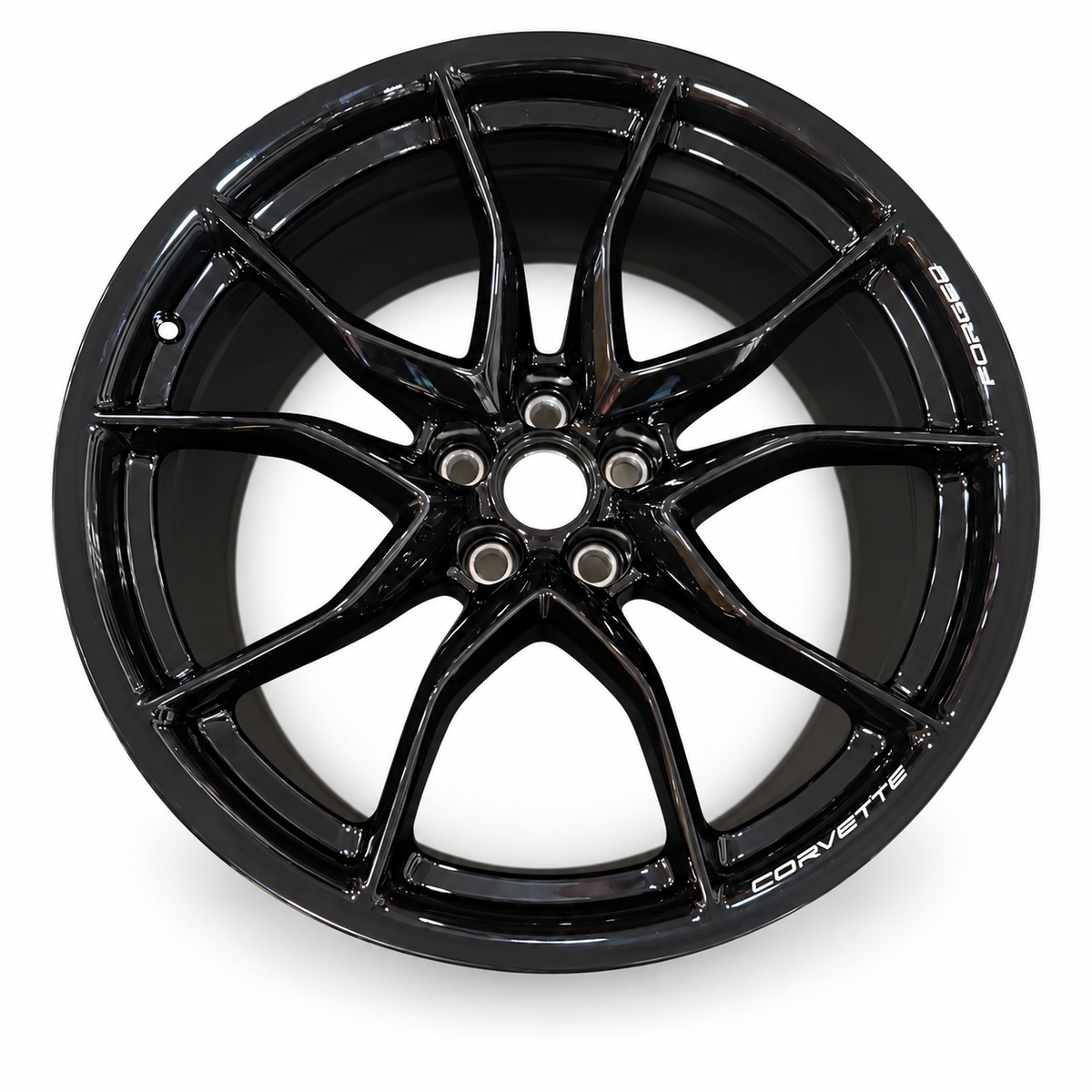 Gloss-black Chevrolet Corvette forged wheel front face, seven split spokes and uncovered center bore