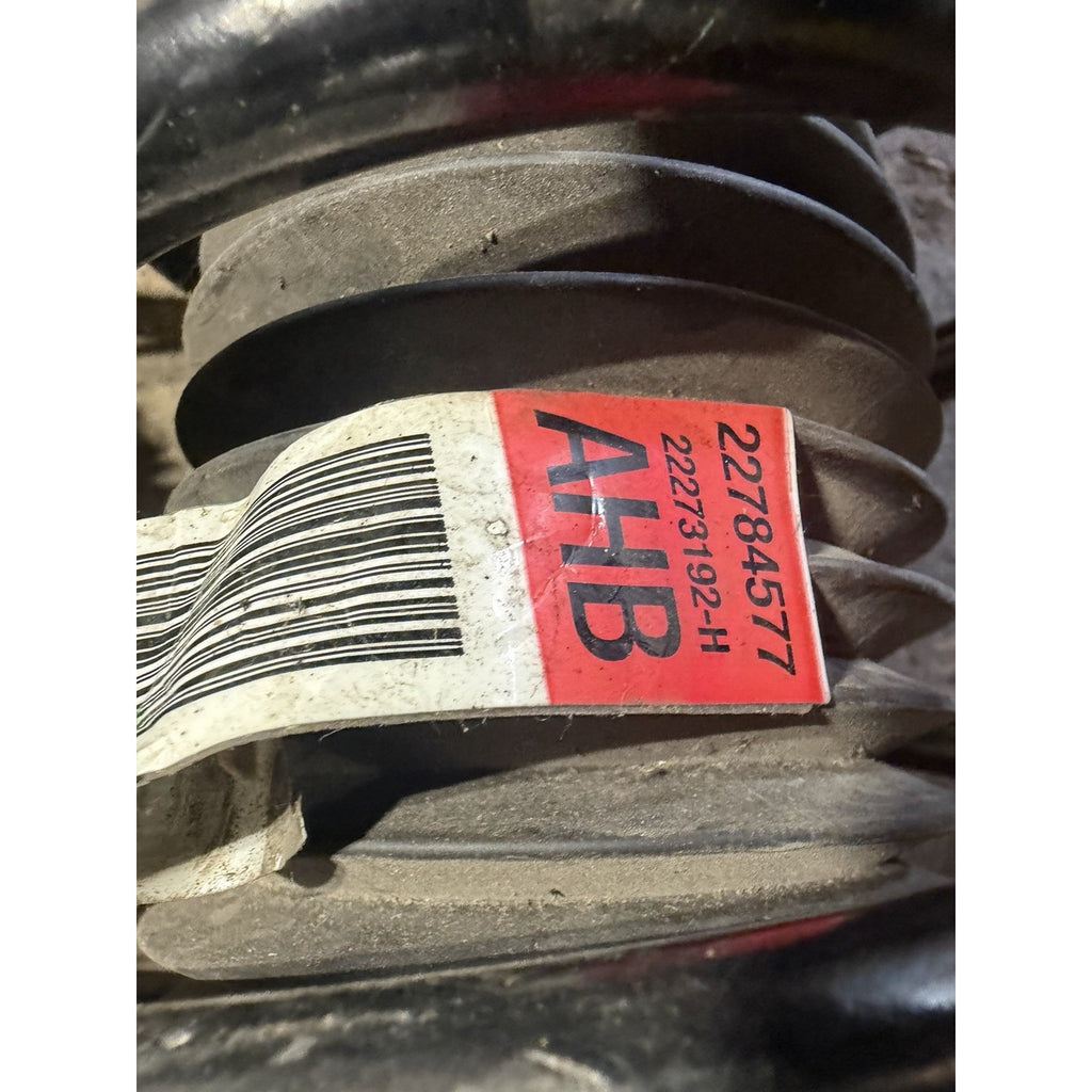 Original coil spring identification label on the Camaro front strut assembly