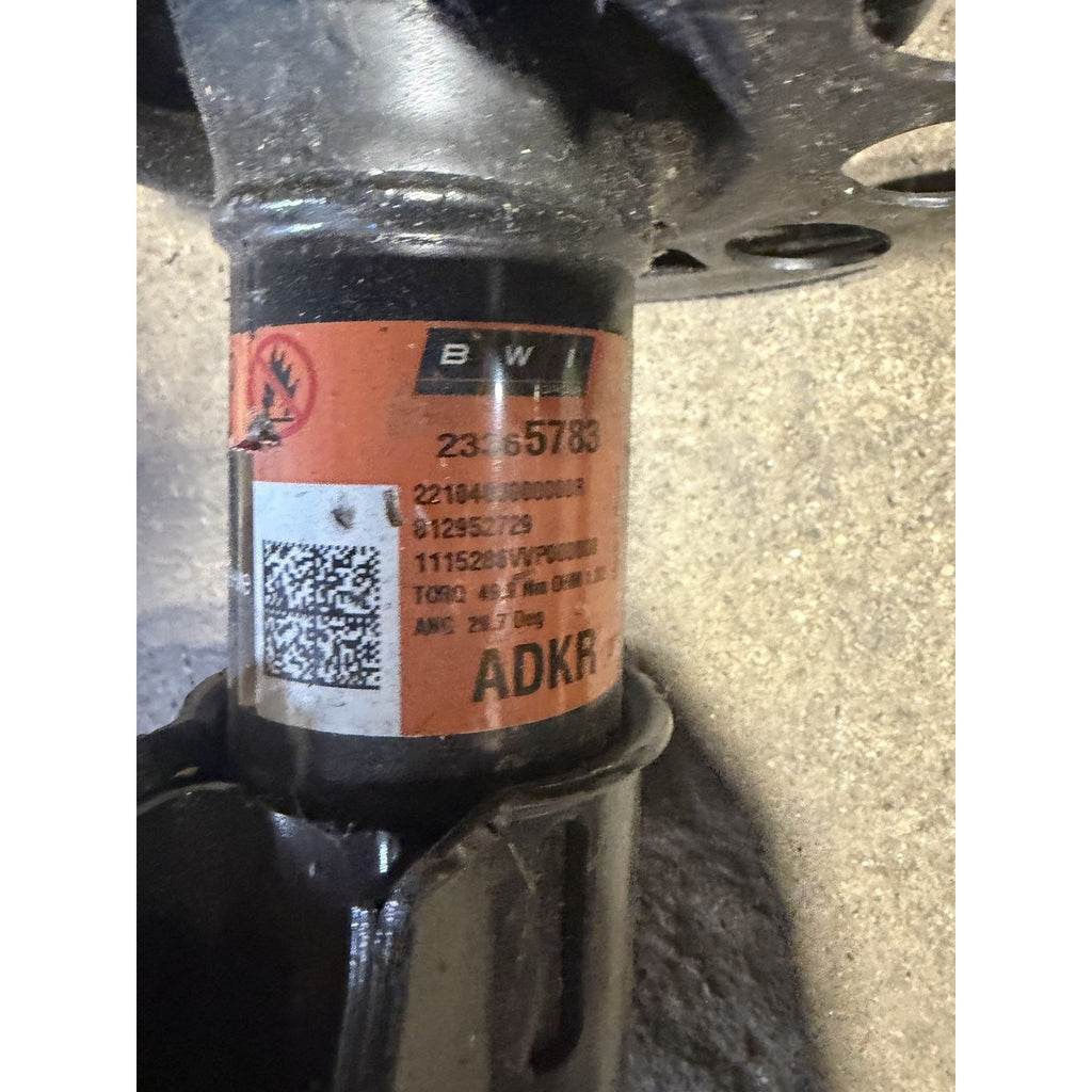 Original right front strut label showing GM part number 23365783
