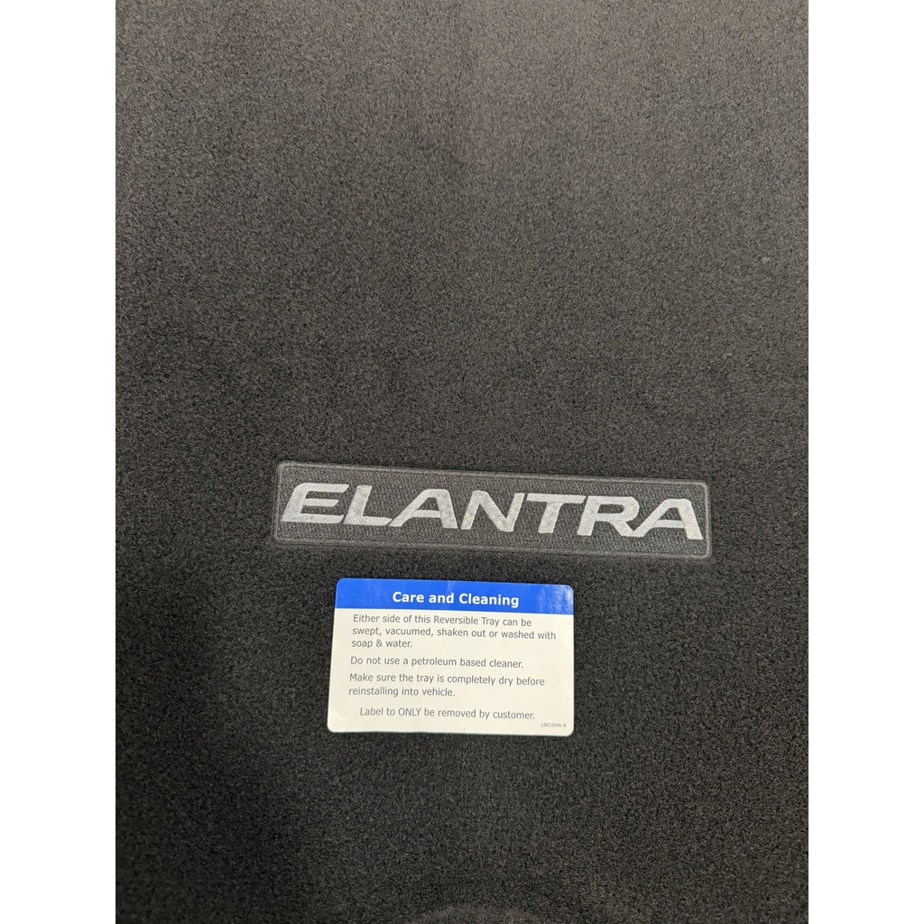 Elantra embroidered logo and reversible cargo-mat care label close-up