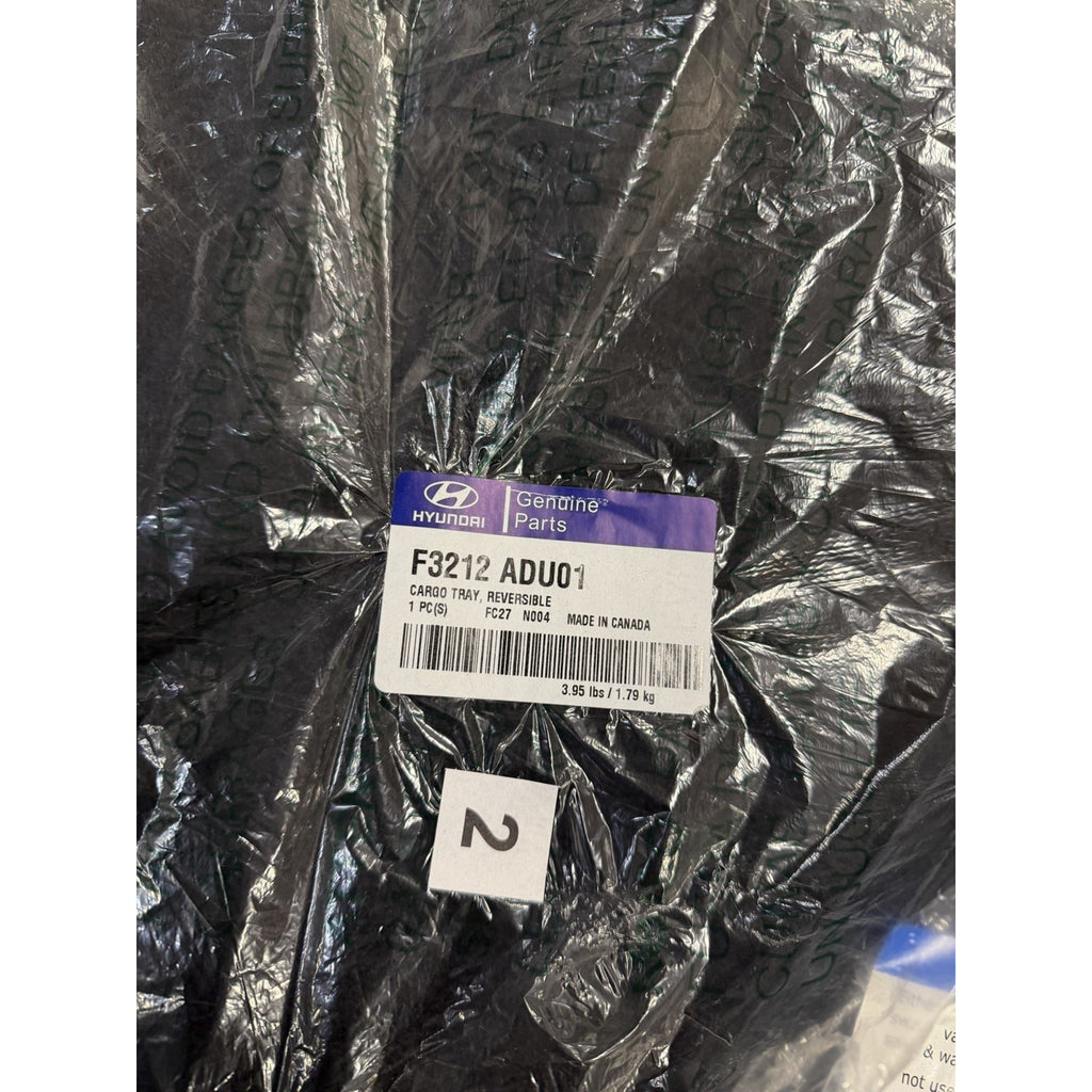 Original Hyundai label showing F3212 ADU01 reversible cargo tray part number